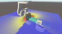 Ein Farbverlauf zeigt durch die AR-Brille an, wo die simulierte Intensität der Strahlung besonders hoch ist (rot) und wo niedrig (blau). Das virtuelle Strahlenschutzschild blockt die Strahlung sichtbar ab (© HSLU/Kim da Motta)